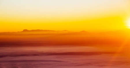sun rise over a fog and mountain  in Thailandの写真素材