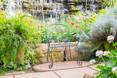 iron Chair in Beautiful gardenの写真素材