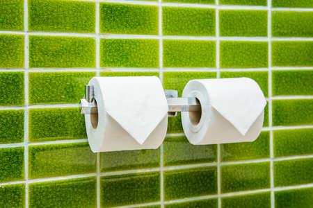 toilet paper rolls in restroomの写真素材