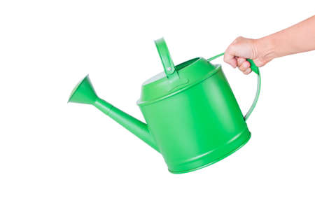 green watering can. It is isolated on a white backgroundの写真素材