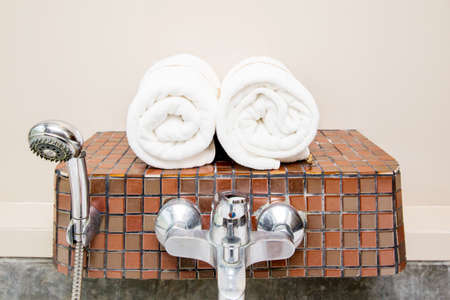 Rolled up white spa towelsの写真素材