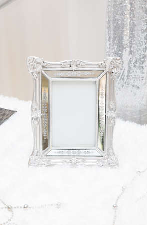 white vintage frame on  table for decoration in wedding receptionの写真素材