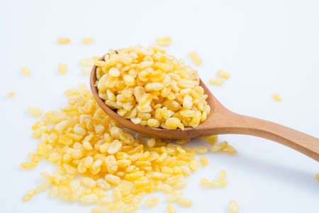 fried soybean in wooden spoon isolated on whiteの写真素材