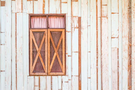 Window of a old wooden houseの写真素材