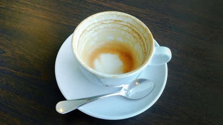 Stock Photo:Empty coffee cup on wooden tableの写真素材