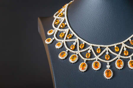 diamonds with yellow sapphire necklace on the black backgroundの写真素材