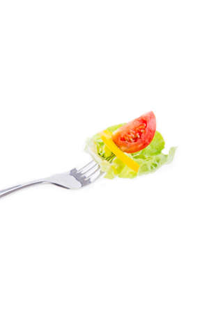Mixed salad on fork isolated on whiteの写真素材