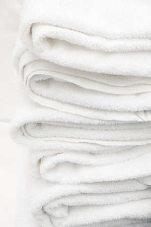 Stacked white spa towelsの写真素材