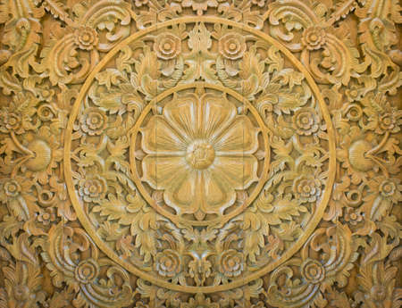 Pattern of flower carved on wood backgroundの写真素材