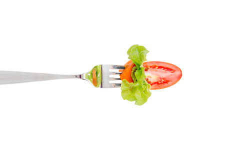 Mixed salad on fork isolated on whiteの写真素材