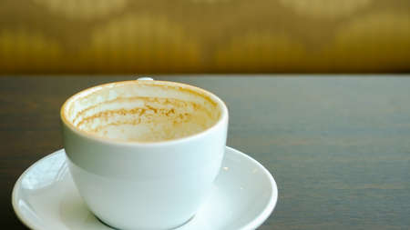 Stock Photo:Empty coffee cup on wooden table