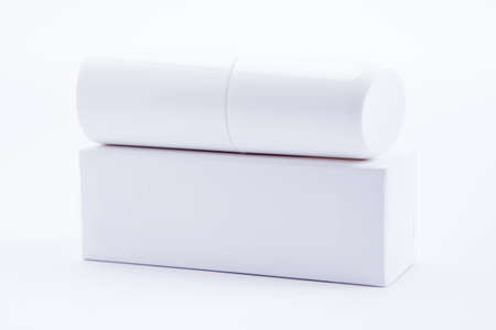 White cosmetics containers, bottle with packageの写真素材