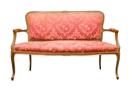 Old red sofa isolated on a whiteの写真素材