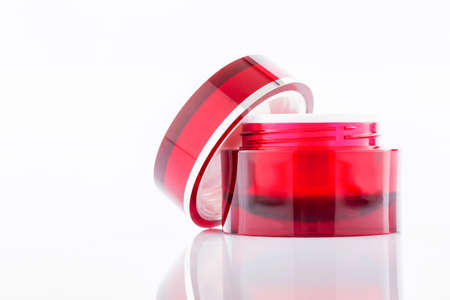 Red Cosmetic containers isolated on whiteの写真素材
