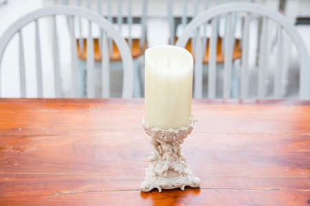 candle on wooden tableの写真素材