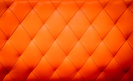 Closeup texture of vintage red leather sofa for backgroundの写真素材