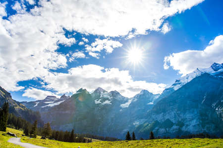 summer landscape with clear mountain lake in the Switzerland Alpsの写真素材