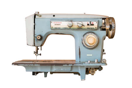 Old sewing machine isolated on white
