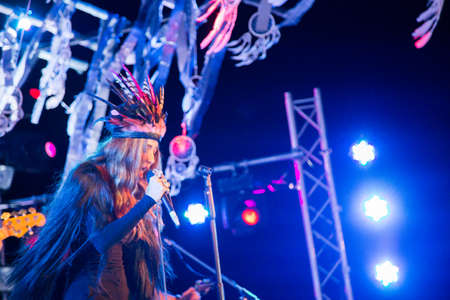 woman singing on the concert