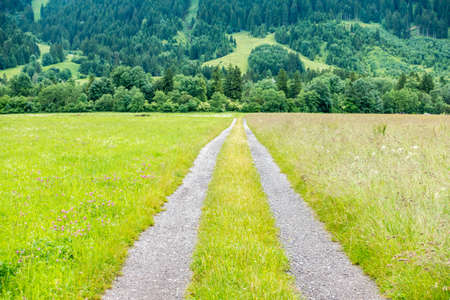 Country Road With mounatin background in Germanyの写真素材