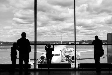 Airport  lounge  with airplane and travelerの写真素材