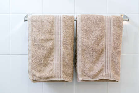 Bathroom Towel - brown towel on a hanger prepared to useの写真素材
