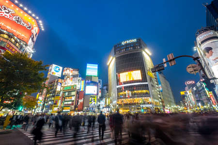 TOKYO, November 14, 2016: Pedestrians cross at Shibuya Crossing. It is one of the world's most famous scramble crosswalks.のeditorial素材