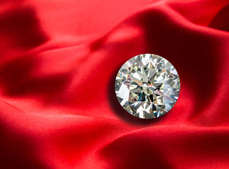 diamond on red background luxury cloth or liquid wave or wavy folds of grunge silk textureの写真素材