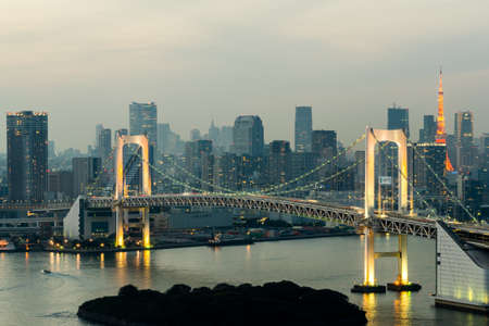 Tokyo Tower skyline and Rainbow Bridge with cityscape at Odaiba Japanのeditorial素材