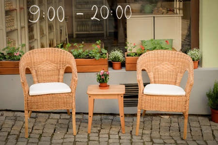 wooden chair in front of cafeの写真素材