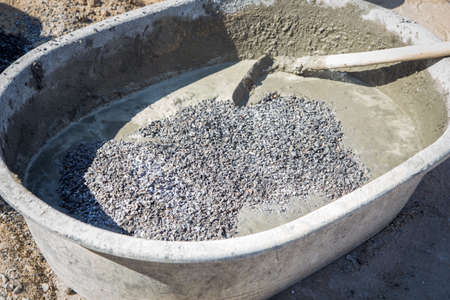 Mixing a cement in salver for applying constructionの写真素材