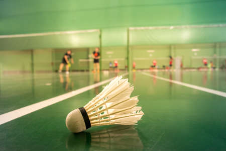 badminton courts with players competingの写真素材