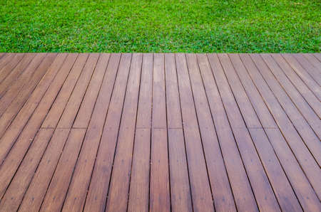 wood background and green grass for backgroundの写真素材