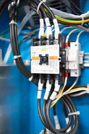 circuit breakers and wire in control panelの写真素材