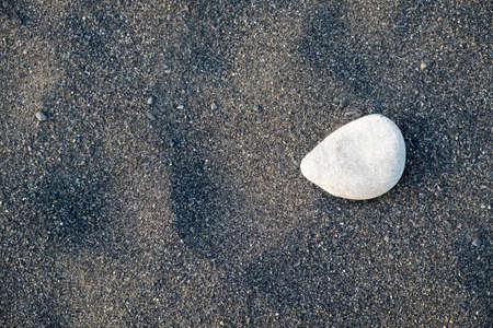 black sand beach with rock at Miho No Matsubara Beach, japanの写真素材