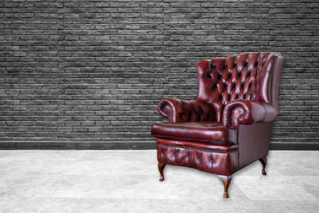 red genuine leather classical style sofa in modern roomの写真素材