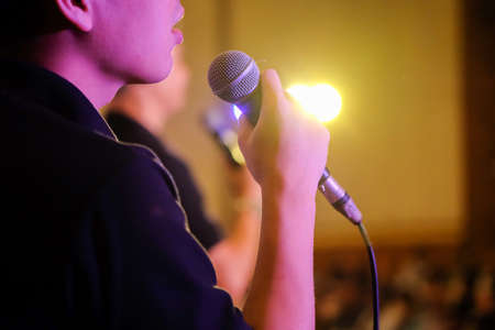singing under spotlightの写真素材