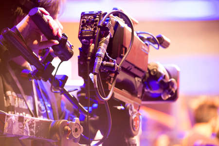 cameraman with headphones with HD camcorderの写真素材