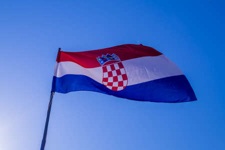 Croatia flag with blue skyの写真素材