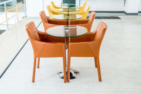 Empty table and chairs in living roomの写真素材