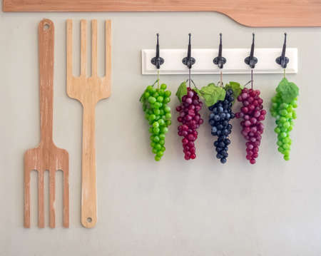 Fake plastic red grapes for decoration.の写真素材