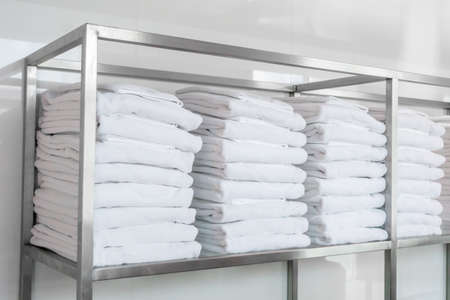 Stacked white spa towelsの写真素材