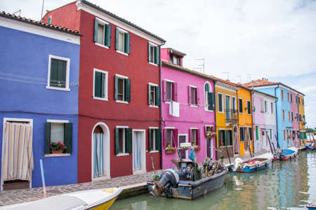 Colorful houses along a canal in Burano near Venice, Italyのeditorial素材