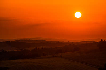 Beautiful sunset over hills of Tuscany, Italyの写真素材