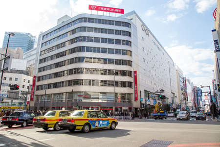 Tokyo, Japan, March 3, 2016: City street in Shinjuku town. Shinjuku is a special ward located in...