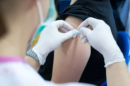 Syringe, medical injection in hand