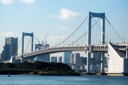 view of Tokyo Tower skyline and Rainbow Bridge with cityscape at Odaiba Japan