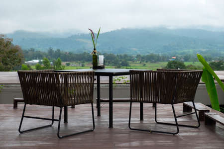 table for two with mountain landscape