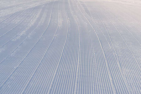 Snow lines made from a snow machine on a ski slope