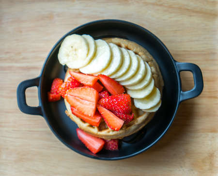 Sweet Homemade  Waffle with strawberry and bananaの写真素材